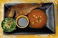 jollof rice with salad and fish