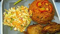 jollof rice with salad and chicken