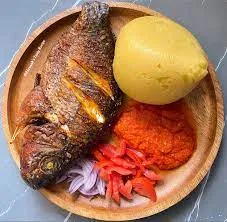 Banku with hot pepper and Fried Tilapia fish