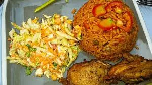 jollof rice with salad and chicken