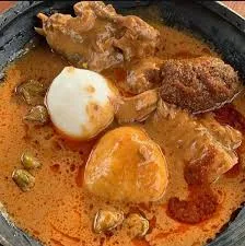 omotuo and groundnut soup with cowmeat